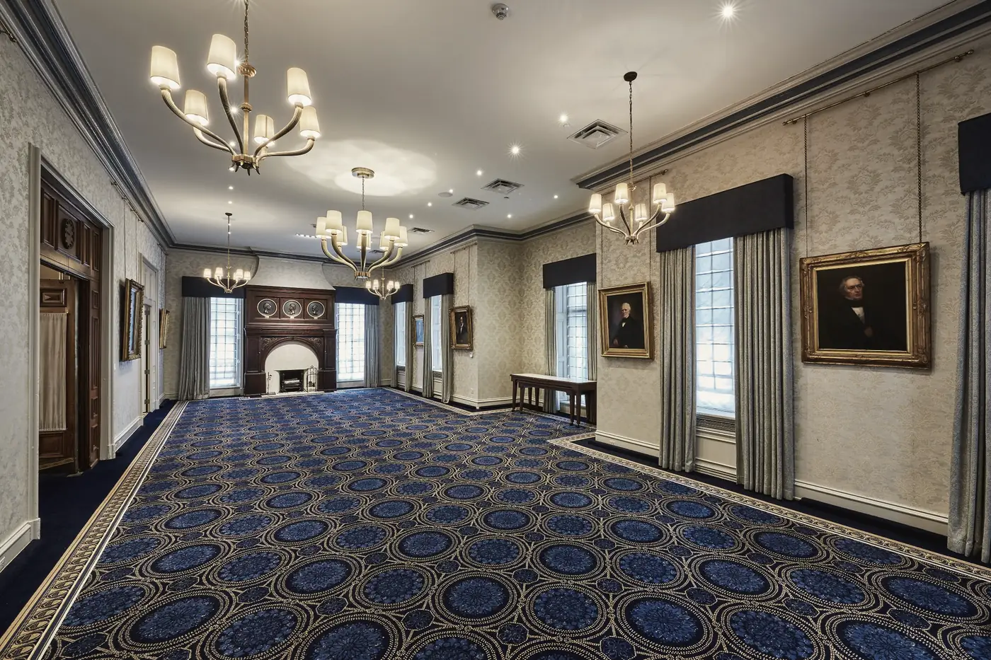 A salon at the Union League, hung with portraits